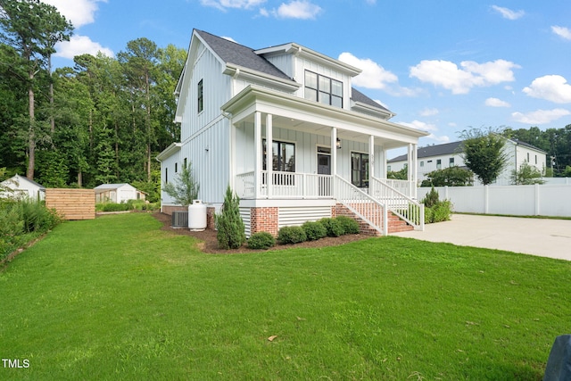 5107 Overhill St, Raleigh, NC 27603 - modern farmhouse style home with board and batten siding, covered porch, driveway, and a shingled roof