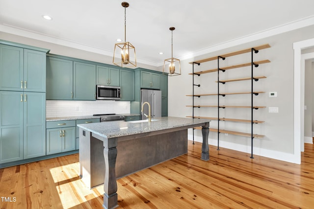 5107 Overhill St, Raleigh, NC 27603 - kitchen with stainless steel appliances, backsplash, a kitchen island with sink, hanging light fixtures, and ornamental molding