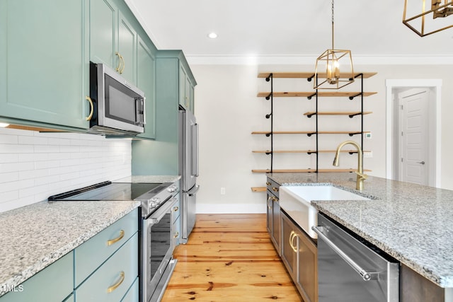 5107 Overhill St, Raleigh, NC 27603 - kitchen with appliances with stainless steel finishes, ornamental molding, light wood-type flooring, decorative backsplash, and recessed lighting