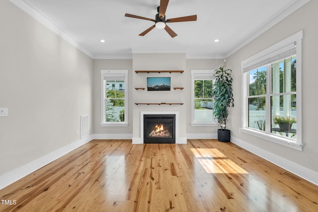 5107 Overhill St, Raleigh, NC 27603 - unfurnished living room with a glass covered fireplace, hardwood / wood-style flooring, ornamental molding, ceiling fan, and recessed lighting