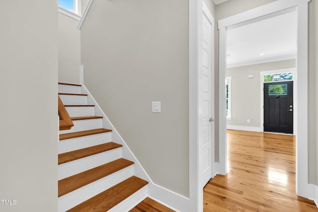 5107 Overhill St, Raleigh, NC 27603 - stairs featuring wood finished floors and crown molding