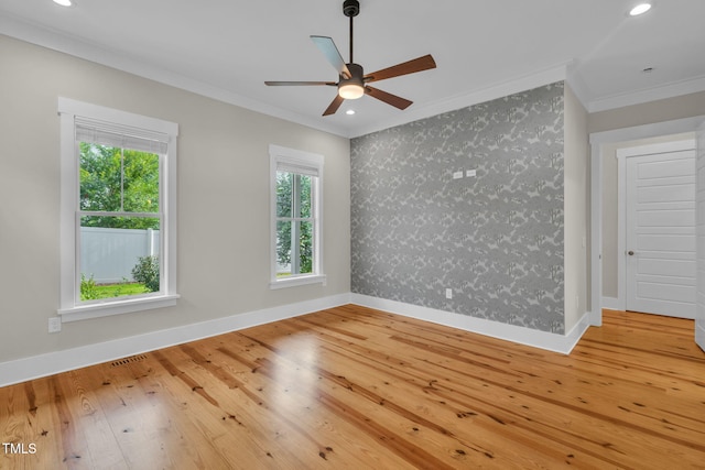 5107 Overhill St, Raleigh, NC 27603 - empty room with ornamental molding, wallpapered walls, wood-type flooring, a ceiling fan, and recessed lighting