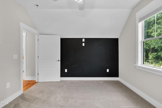 5107 Overhill St, Raleigh, NC 27603 - empty room featuring lofted ceiling, carpet flooring, healthy amount of natural light, and ceiling fan