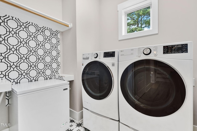 5107 Overhill St, Raleigh, NC 27603 - laundry area featuring separate washer and dryer and baseboards