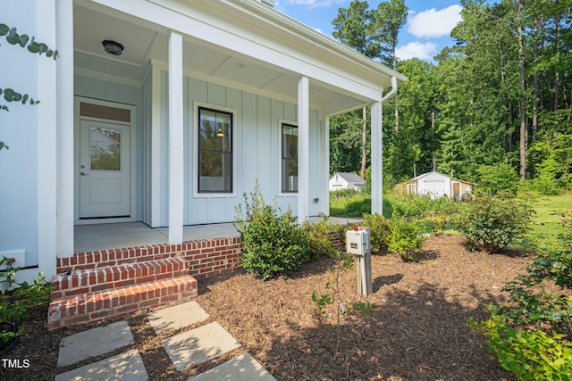 5107 Overhill St, Raleigh, NC 27603 - view of exterior entry with board and batten siding and a porch