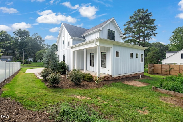 5107 Overhill St, Raleigh, NC 27603 - view of home's exterior featuring board and batten siding, roof with shingles, and covered porch