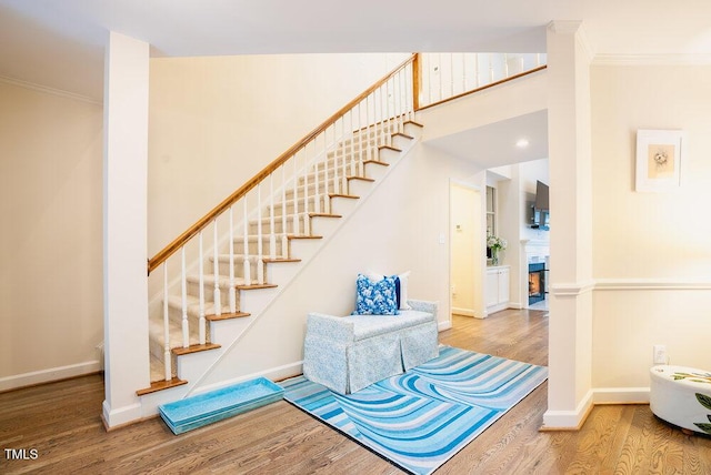 10 Marchmont Ct, Durham, NC 27705 - staircase featuring wood finished floors and crown molding