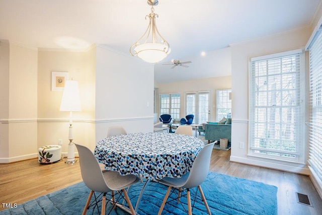 10 Marchmont Ct, Durham, NC 27705 - dining area with wood finished floors, ceiling fan, and ornamental molding