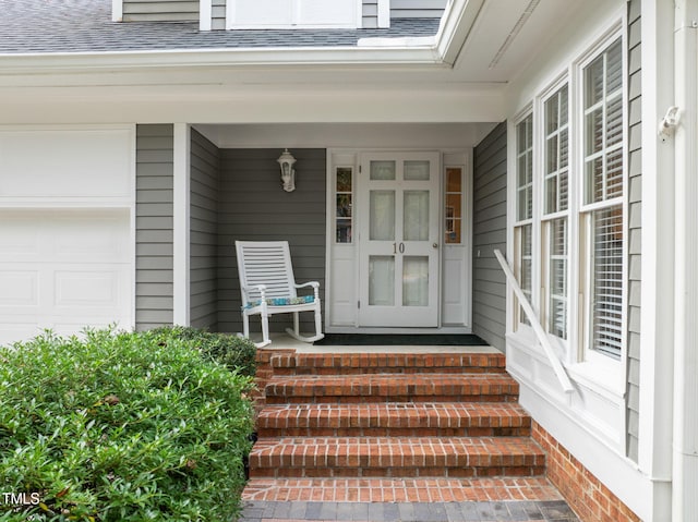 10 Marchmont Ct, Durham, NC 27705 - property entrance with roof with shingles, a garage, and covered porch