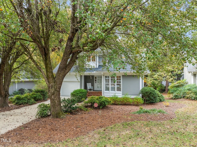 10 Marchmont Ct, Durham, NC 27705 - obstructed view of property featuring an attached garage, covered porch, and driveway