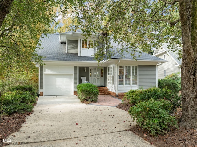 10 Marchmont Ct, Durham, NC 27705 - traditional-style house featuring concrete driveway, a shingled roof, and a porch