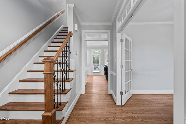 202 Stoneleigh Dr, Cary, NC 27511 - stairs featuring wood finished floors, ornamental molding, and french doors