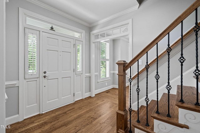 202 Stoneleigh Dr, Cary, NC 27511 - entrance foyer with wood finished floors, ornamental molding, and stairs