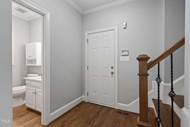 202 Stoneleigh Dr, Cary, NC 27511 - foyer featuring wood finished floors, ornamental molding, and stairs