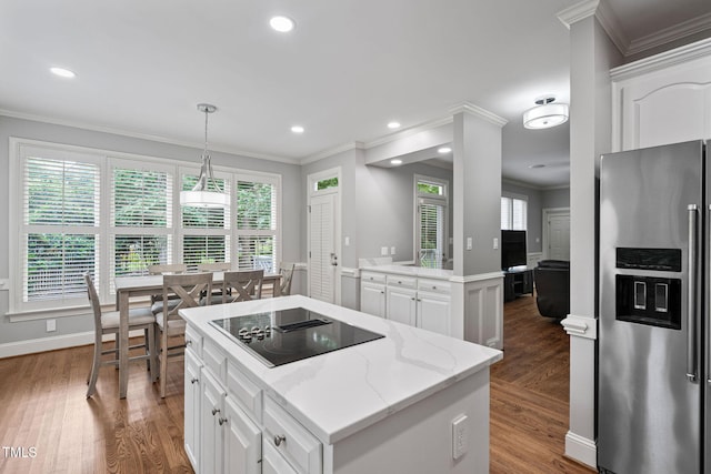 202 Stoneleigh Dr, Cary, NC 27511 - kitchen featuring stainless steel refrigerator with ice dispenser, black electric stovetop, ornamental molding, wood finished floors, and white cabinets