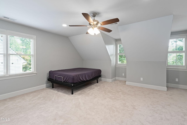 202 Stoneleigh Dr, Cary, NC 27511 - carpeted bedroom featuring multiple windows, vaulted ceiling, ceiling fan, and recessed lighting