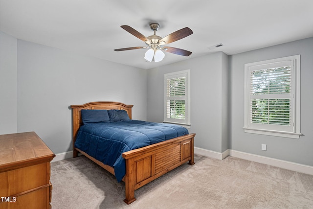 202 Stoneleigh Dr, Cary, NC 27511 - bedroom with multiple windows, light colored carpet, and ceiling fan