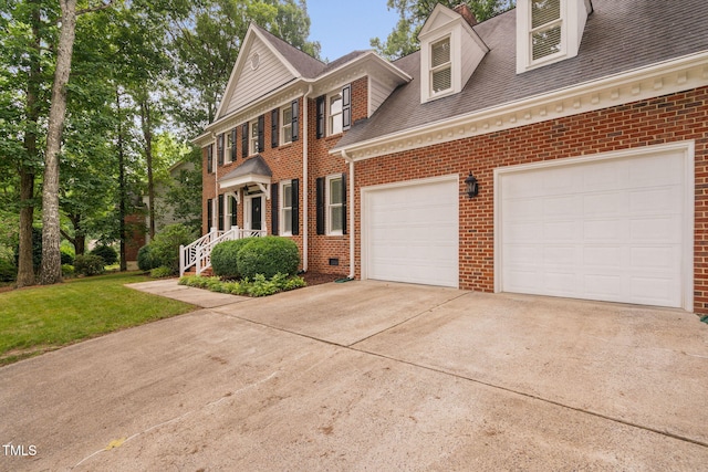 202 Stoneleigh Dr, Cary, NC 27511 - view of front of property featuring brick siding, driveway, roof with shingles, a garage, and a front yard
