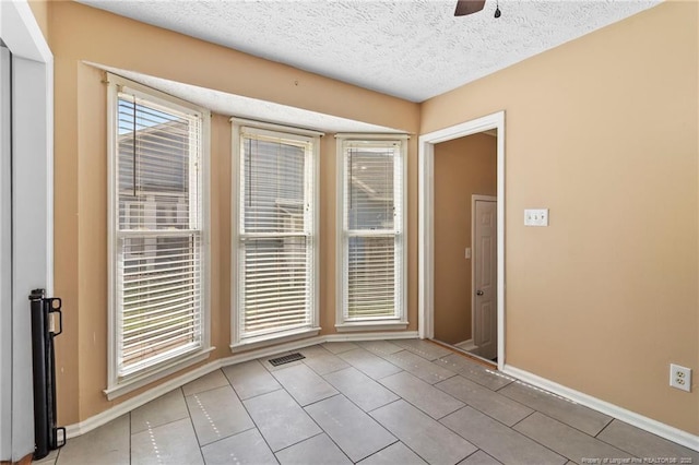 3820 Crusader Dr, Hope Mills, NC 28348 - tiled empty room featuring a textured ceiling and ceiling fan