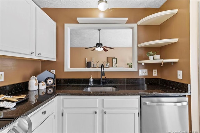 3820 Crusader Dr, Hope Mills, NC 28348 - kitchen with stainless steel dishwasher, white cabinetry, a ceiling fan, dark stone counters, and a textured ceiling