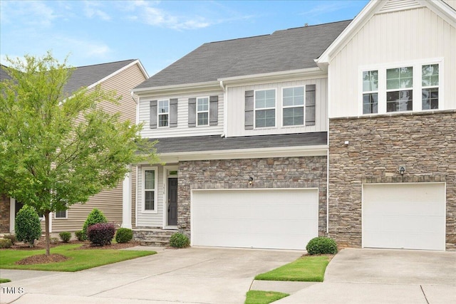 1416 Southpoint Trl, Durham, NC 27713 - view of front facade with stone siding, an attached garage, concrete driveway, and board and batten siding
