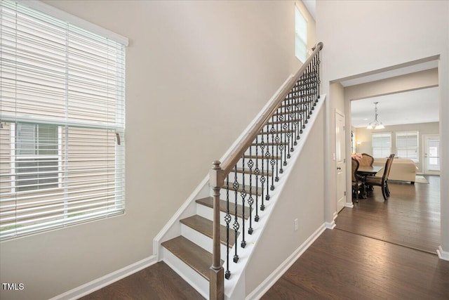 1416 Southpoint Trl, Durham, NC 27713 - stairs featuring a chandelier and wood finished floors
