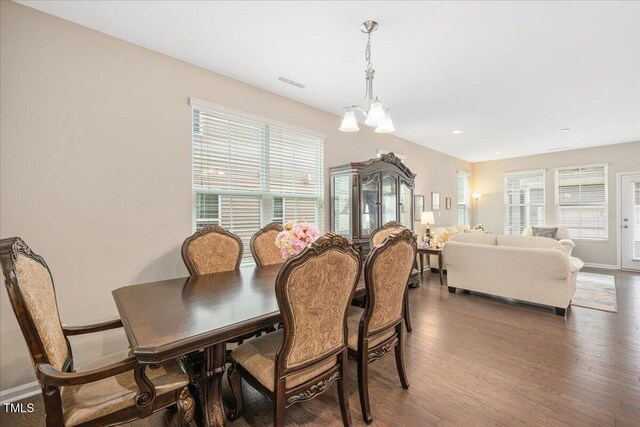 1416 Southpoint Trl, Durham, NC 27713 - dining room featuring wood finished floors and a chandelier