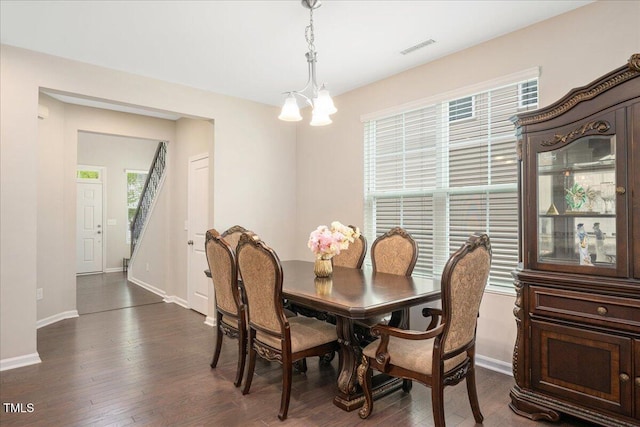 1416 Southpoint Trl, Durham, NC 27713 - dining room with a chandelier and dark wood-style floors