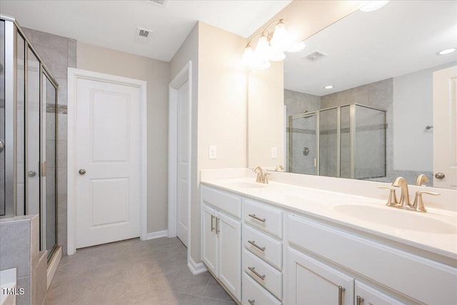 1416 Southpoint Trl, Durham, NC 27713 - bathroom featuring a stall shower, double vanity, and tile patterned flooring