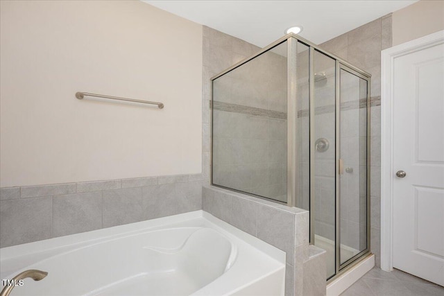 1416 Southpoint Trl, Durham, NC 27713 - full bathroom featuring a stall shower, a bath, and tile patterned flooring