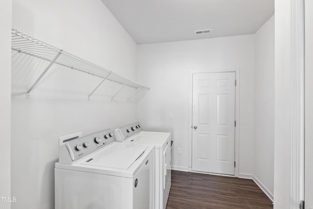 202 E Painted Way, Clayton, NC 27527 - laundry room with washer and clothes dryer and dark wood-style flooring