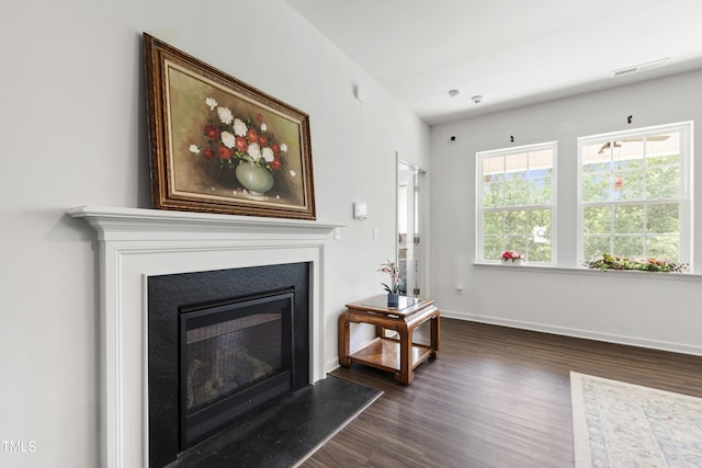 202 E Painted Way, Clayton, NC 27527 - living area featuring dark wood finished floors and a glass covered fireplace