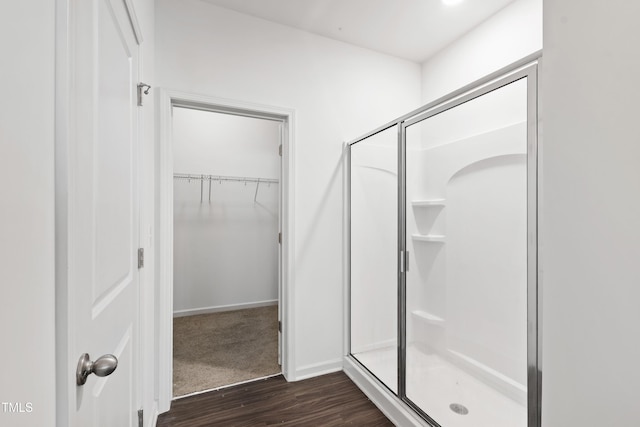 202 E Painted Way, Clayton, NC 27527 - full bath with a shower stall, wood finished floors, and a walk in closet