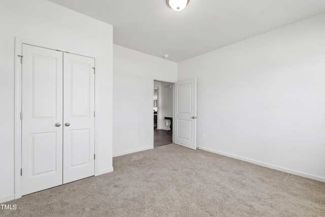 202 E Painted Way, Clayton, NC 27527 - unfurnished bedroom featuring carpet flooring and a closet