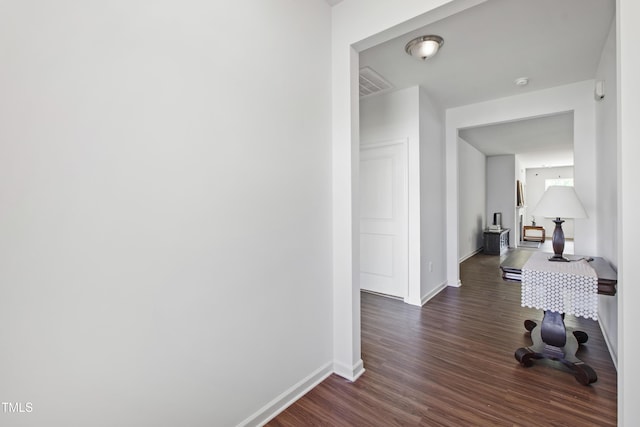 202 E Painted Way, Clayton, NC 27527 - hall featuring dark wood finished floors and baseboards