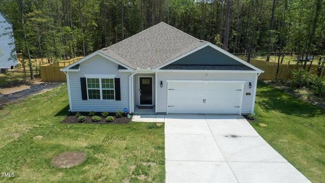 248 Hawksmoore Ln, Lillington, NC 27546 - view of front of home featuring roof with shingles, an attached garage, concrete driveway, and a wooded view
