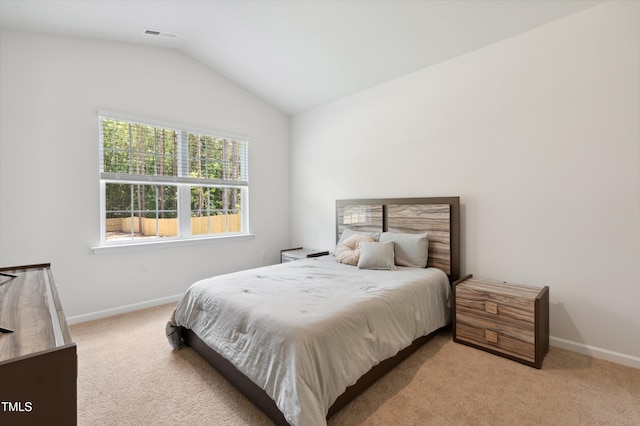 248 Hawksmoore Ln, Lillington, NC 27546 - bedroom featuring light colored carpet and vaulted ceiling