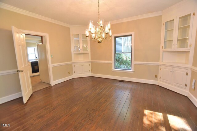 2708 Coleberry Trl, Rocky Mount, NC 27804 - empty room with dark wood-style floors, a chandelier, healthy amount of natural light, ornamental molding, and built in features