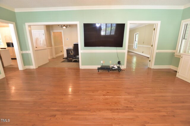 2708 Coleberry Trl, Rocky Mount, NC 27804 - living room with wood finished floors, ornamental molding, and a chandelier