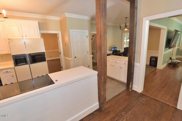 2708 Coleberry Trl, Rocky Mount, NC 27804 - kitchen featuring white fridge with ice dispenser, crown molding, dark wood finished floors, and white cabinetry