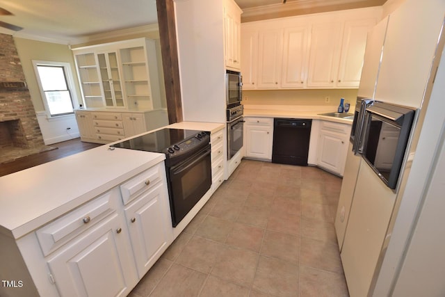 2708 Coleberry Trl, Rocky Mount, NC 27804 - kitchen with black appliances, crown molding, white cabinets, a peninsula, and light countertops