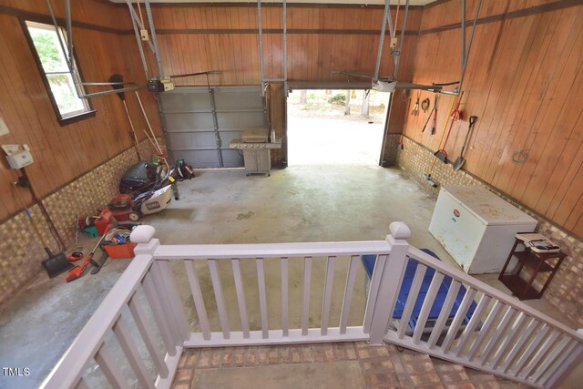 2708 Coleberry Trl, Rocky Mount, NC 27804 - garage with wood walls and a garage door opener