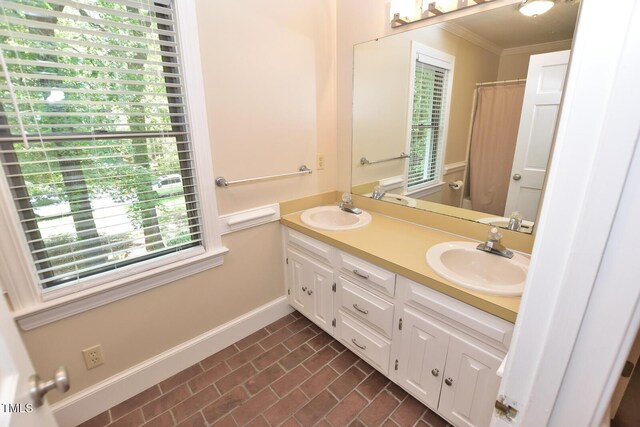 2708 Coleberry Trl, Rocky Mount, NC 27804 - full bathroom featuring ornamental molding, brick patterned floors, double vanity, and a shower with curtain