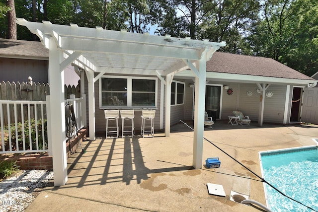 2708 Coleberry Trl, Rocky Mount, NC 27804 - back of house featuring a pergola, a patio area, an outdoor pool, and roof with shingles
