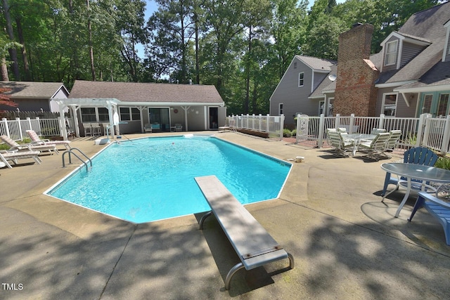 2708 Coleberry Trl, Rocky Mount, NC 27804 - view of swimming pool with a diving board, an outdoor structure, a patio area, an exterior structure, and a pergola