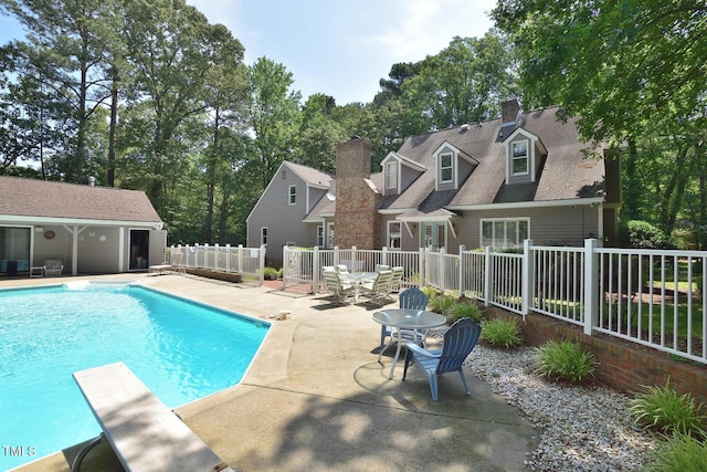 2708 Coleberry Trl, Rocky Mount, NC 27804 - view of swimming pool with a patio, a diving board, and an outbuilding