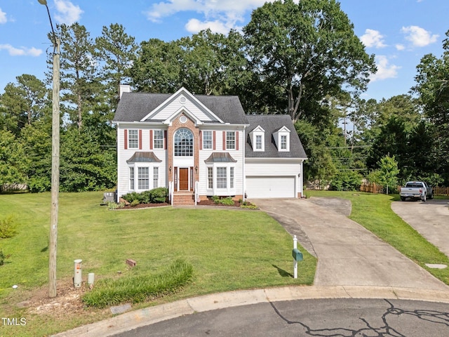 8 Summertime Ct, Durham, NC 27707 - view of front facade featuring driveway, a front lawn, a garage, and a chimney