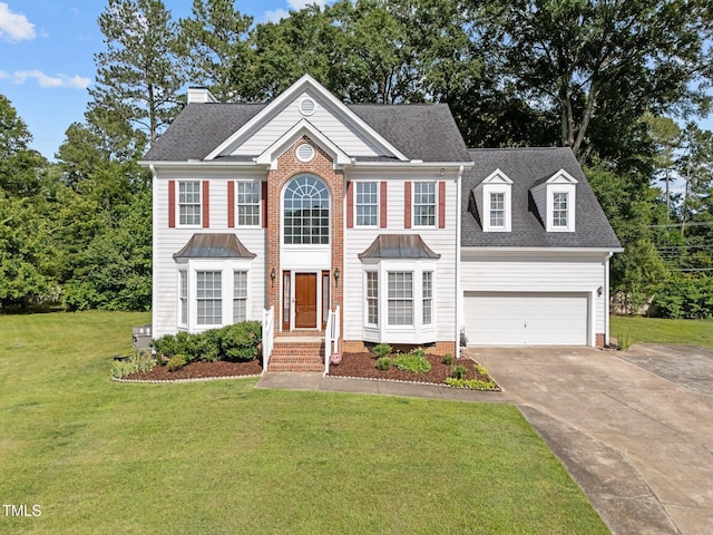 8 Summertime Ct, Durham, NC 27707 - colonial-style house with driveway, a front yard, an attached garage, a chimney, and a shingled roof