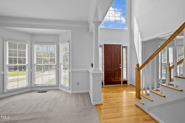 8 Summertime Ct, Durham, NC 27707 - foyer entrance featuring decorative columns, plenty of natural light, crown molding, and stairway