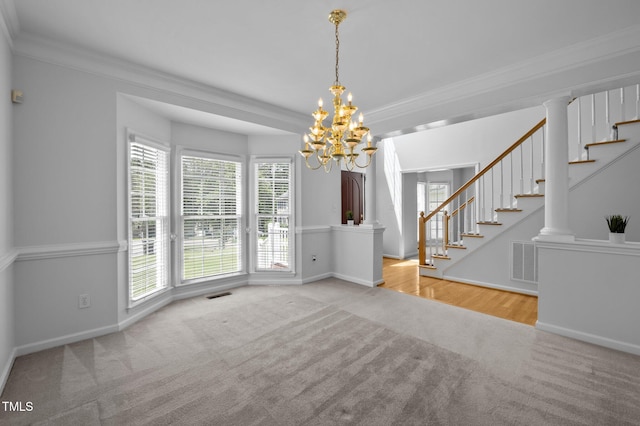 8 Summertime Ct, Durham, NC 27707 - unfurnished dining area featuring carpet, a chandelier, stairway, and crown molding